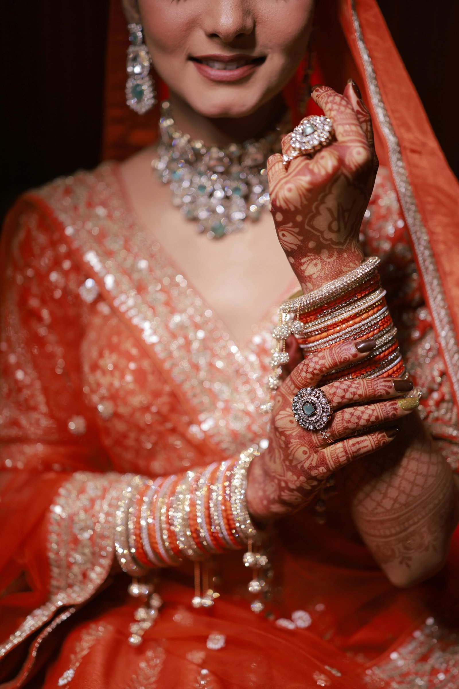 Stunning Indian bride showcasing intricate henna and traditional jewelry.